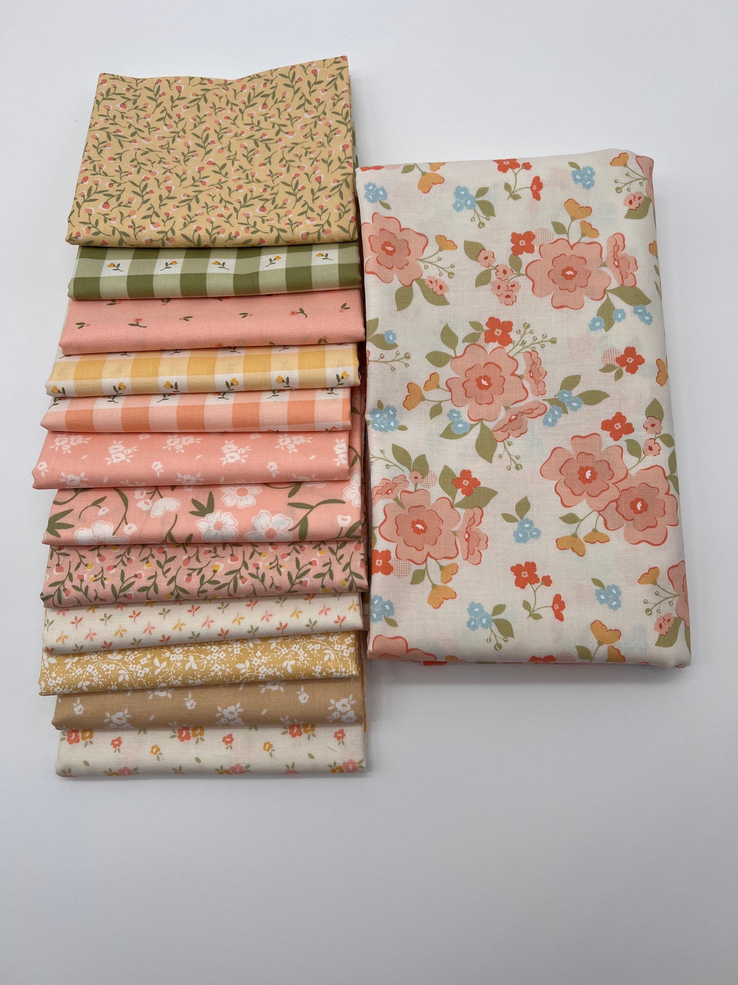 Flower Girl by My Sew Quilty Life for Moda 12 Fat Quarters and 2 yards of fabric from the same line. This is a quilt kit.